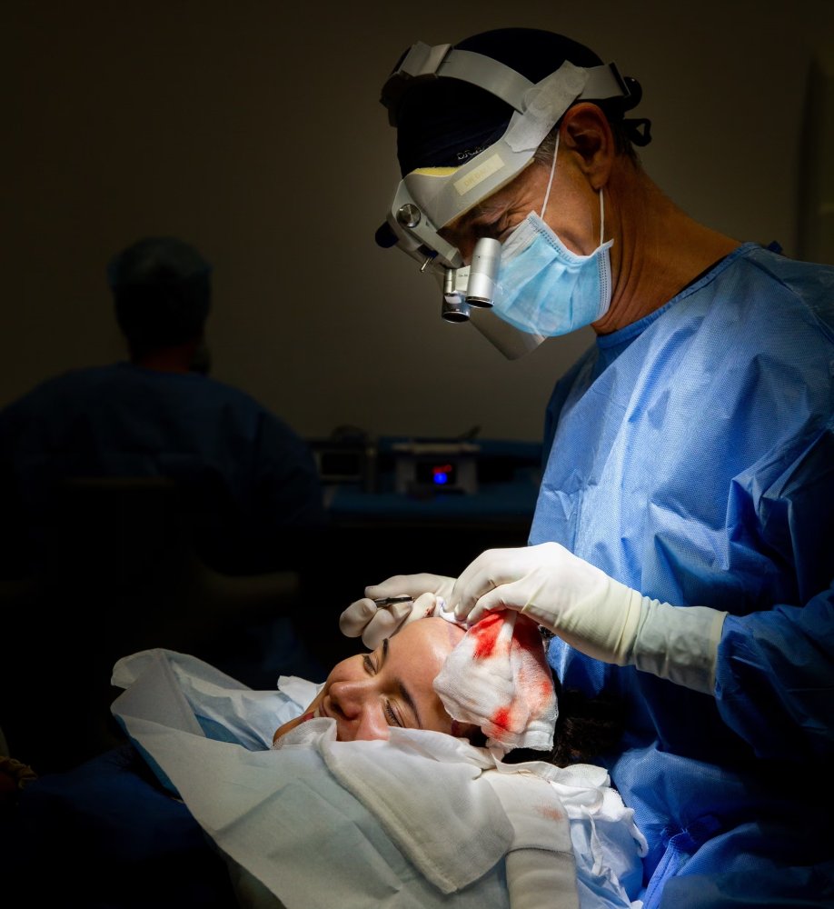 Dr Ball making the recipient site incisions for Aria's new hairline..jpeg